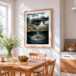 Surreal eye in clouds with tear cross stitch artwork displayed on wall as home decor