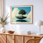 Surreal floating boat and tree cross stitch artwork displayed on wall as home decor