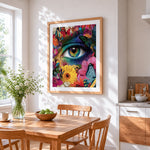 Surreal floral eye with butterflies cross stitch artwork displayed on wall as home decor