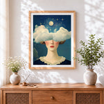 Finished surreal girl with cloud eyes cross stitch artwork displayed