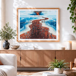 Finished surreal twisted red architecture cross stitch artwork displayed