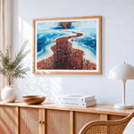 Surreal twisted red architecture cross stitch artwork displayed on wall as home decor
