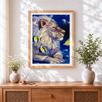Finished surreal underwater lion and fish cross stitch artwork displayed