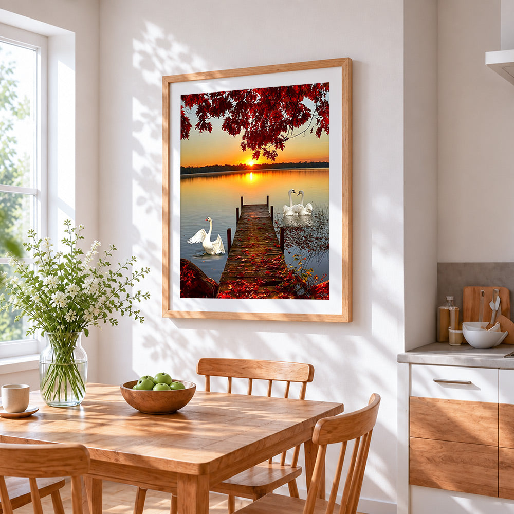 Swans on a lake at sunset paint by numbers artwork displayed on wall as home decor