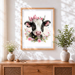 Finished sweet cow with blossom crown cross stitch artwork displayed