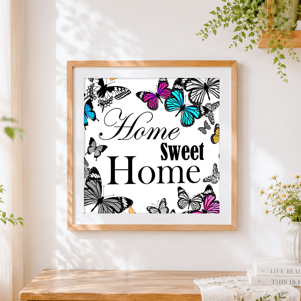 Finished sweet home and colourful butterflies cross stitch artwork displayed