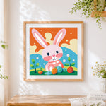 Finished sweet pink bunny with berries cross stitch artwork displayed