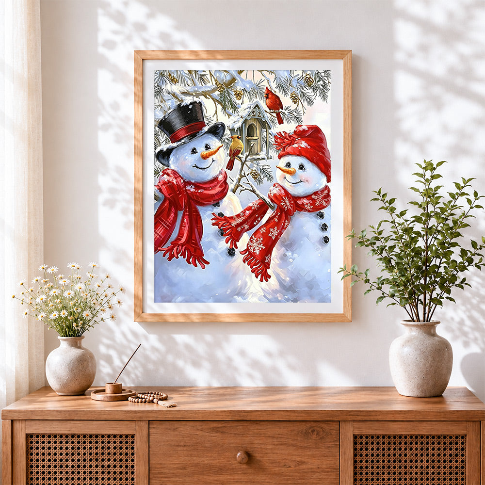 Finished sweet snowman couple with red scarves cross stitch artwork displayed