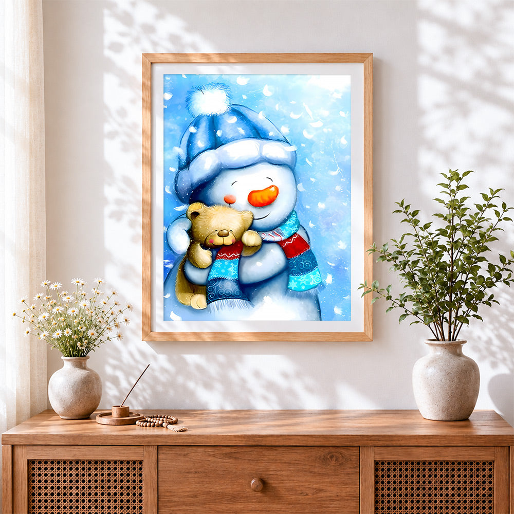 Finished sweet snowman in blue hat cuddling a bear cross stitch artwork displayed