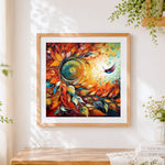 Finished swirling leaves and hummingbird cross stitch artwork displayed
