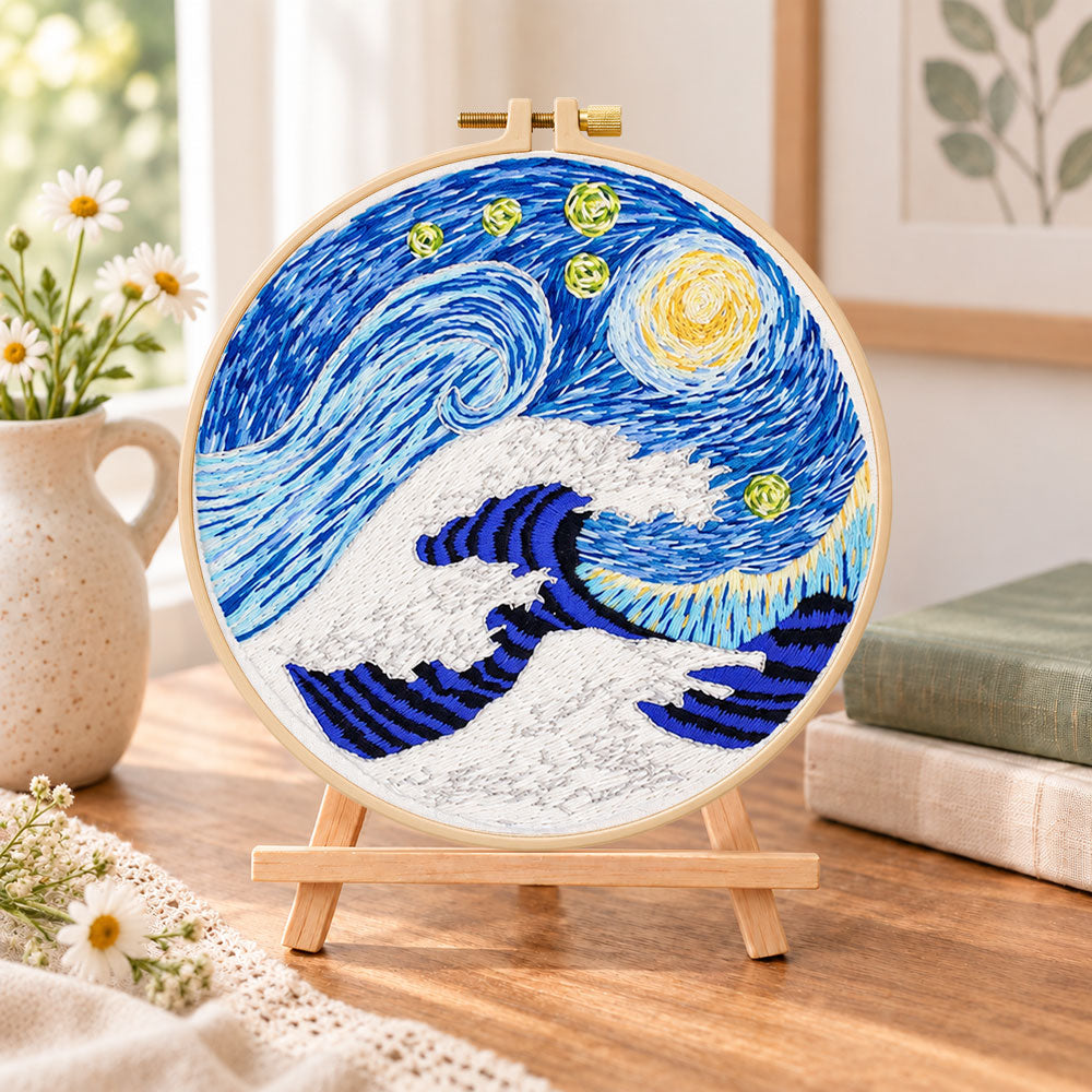Swirling ocean waves embroidery kit finished hoop displayed on a wooden stand as cosy tabletop decor