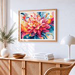 Swirling rainbow dahlia cross stitch artwork displayed on wall as home decor