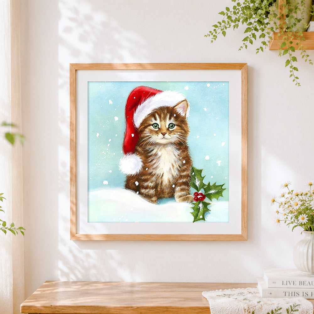 Finished tabby cat in santa hat with holly cross stitch artwork displayed