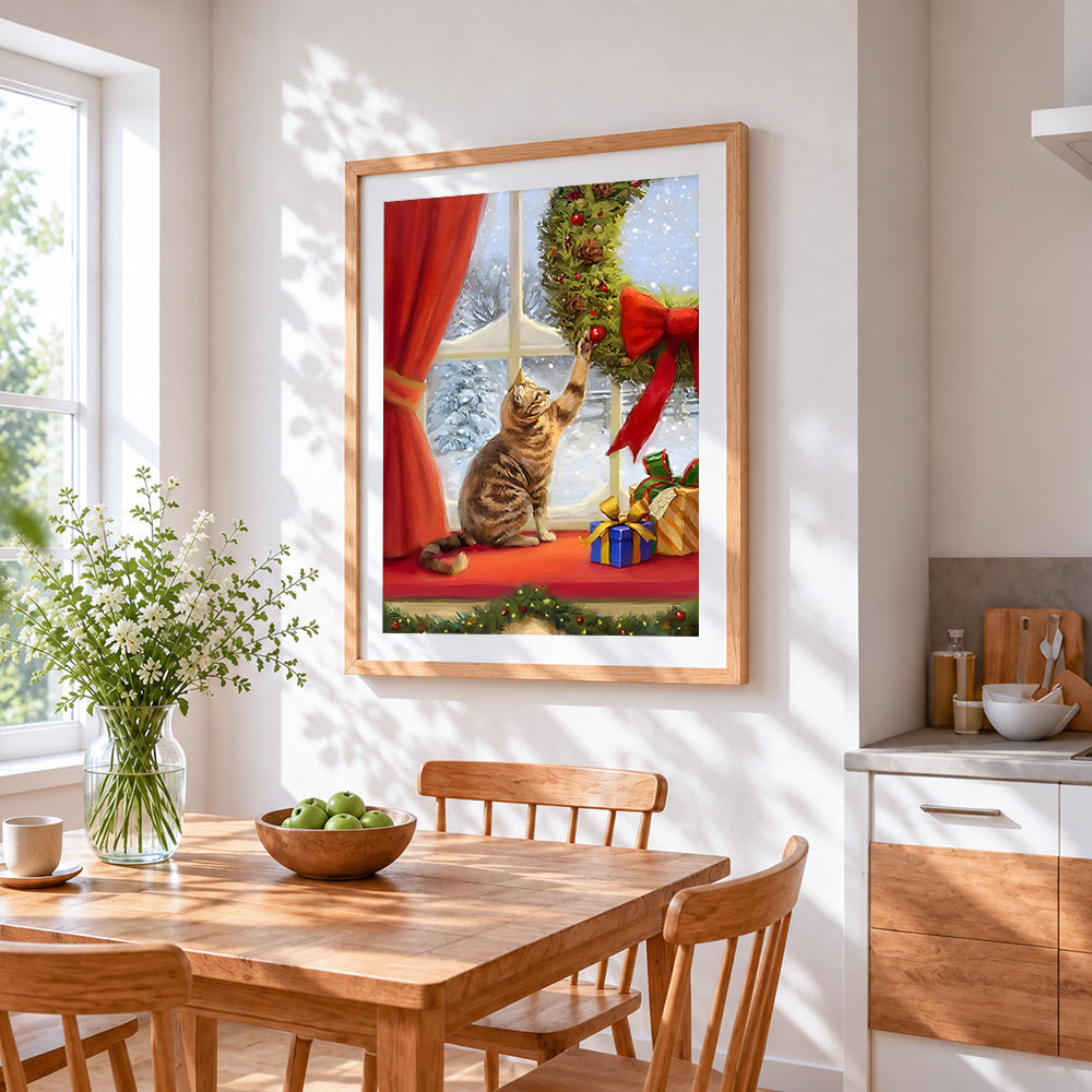 Tabby cat playing with a christmas wreath paint by numbers artwork displayed on wall as home decor