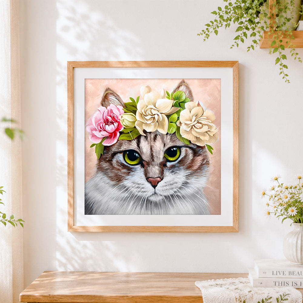 Finished tabby cat with flower crown cross stitch artwork displayed