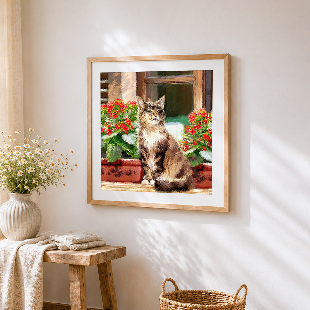 Tabby cat with red flowers cross stitch artwork displayed on wall as home decor