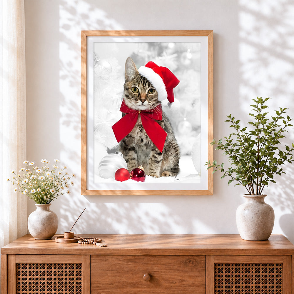 Finished tabby cat with santa hat and red bow cross stitch artwork displayed