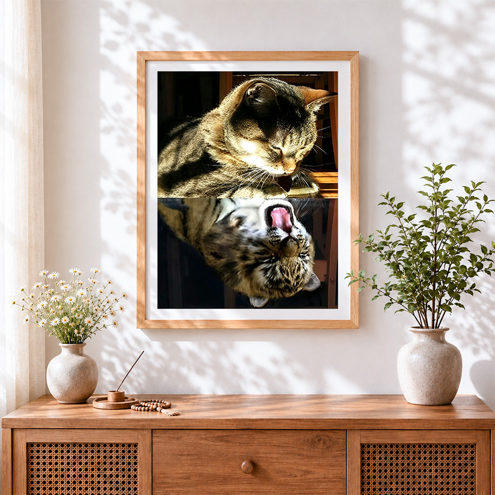 Finished tabby cat yawning reflection cross stitch artwork displayed