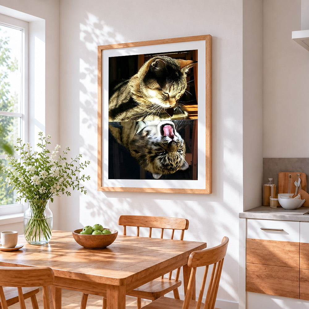 Tabby cat yawning reflection cross stitch artwork displayed on wall as home decor