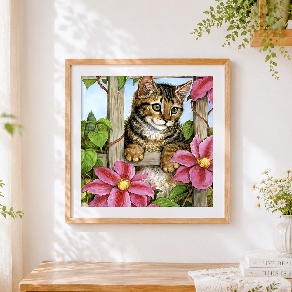 Finished tabby kitten on garden trellis cross stitch artwork displayed