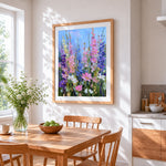 Tall pink and blue wildflowers cross stitch artwork displayed on wall as home decor