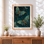 Finished teal and gold ornamental butterflies cross stitch artwork displayed
