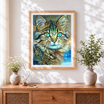 Finished teal eyed abstract cat cross stitch artwork displayed