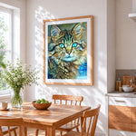 Teal eyed abstract cat cross stitch artwork displayed on wall as home decor