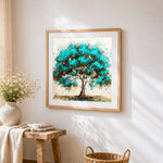 Teal splatter tree cross stitch artwork displayed on wall as home decor