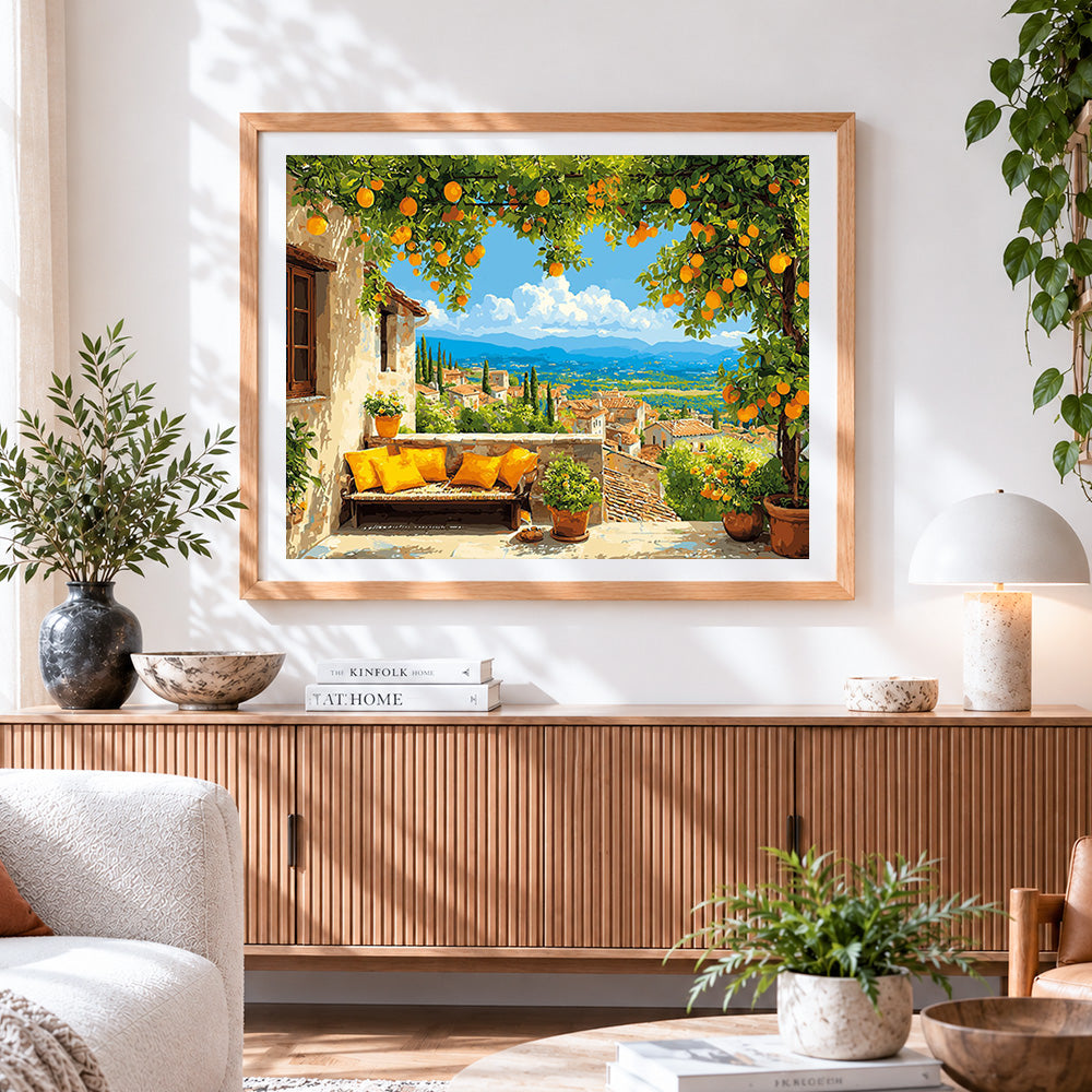 Finished terrace with orange tree and mountain view cross stitch artwork displayed