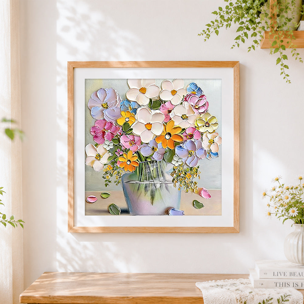 Finished textured floral still life cross stitch artwork displayed