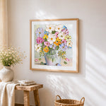 Textured floral still life cross stitch artwork displayed on wall as home decor