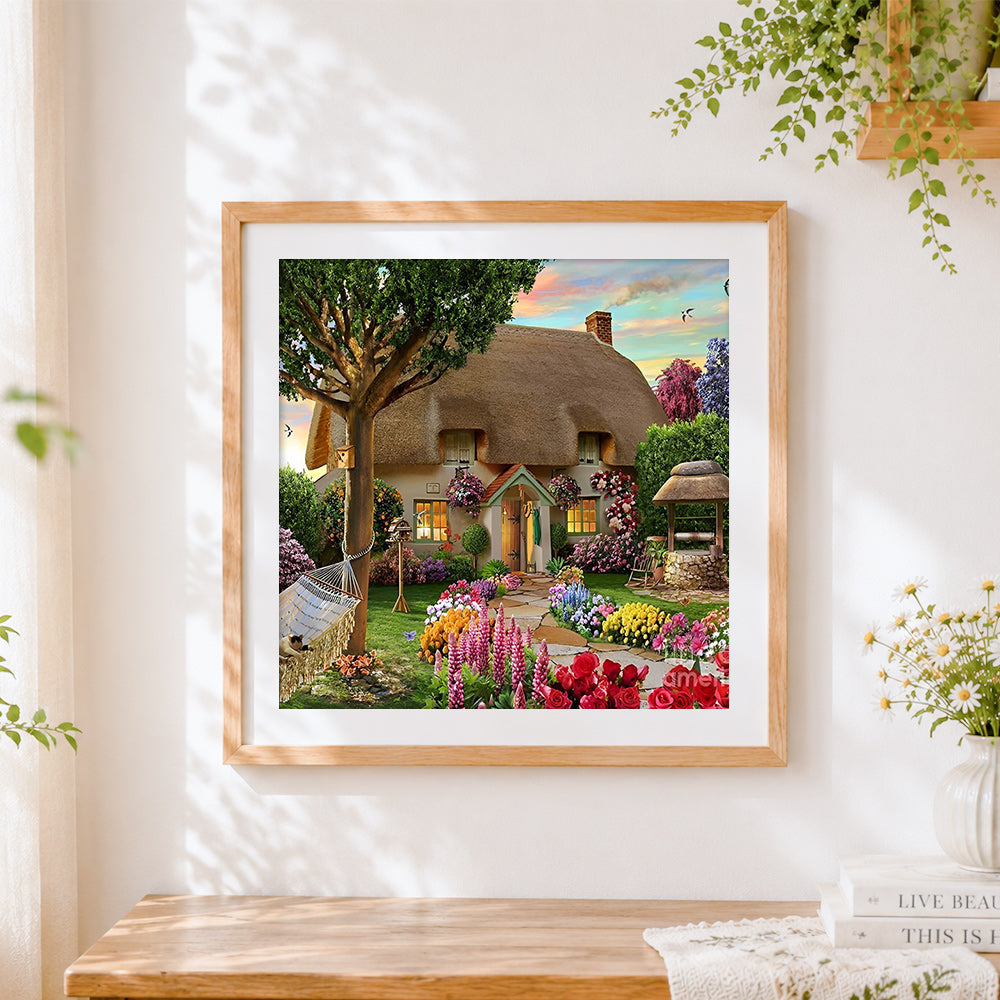 Finished thatched cottage with hammock cross stitch artwork displayed