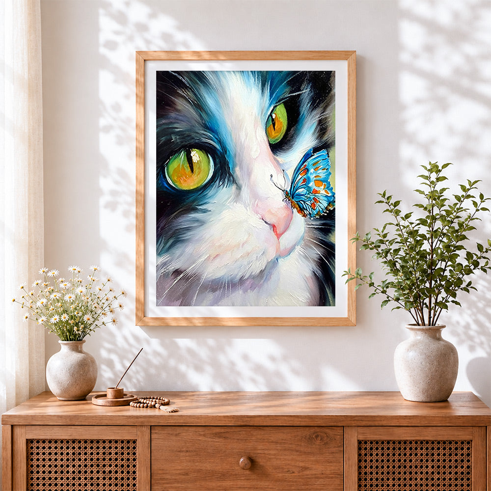 Finished the curious cat and blue butterfly cross stitch artwork displayed