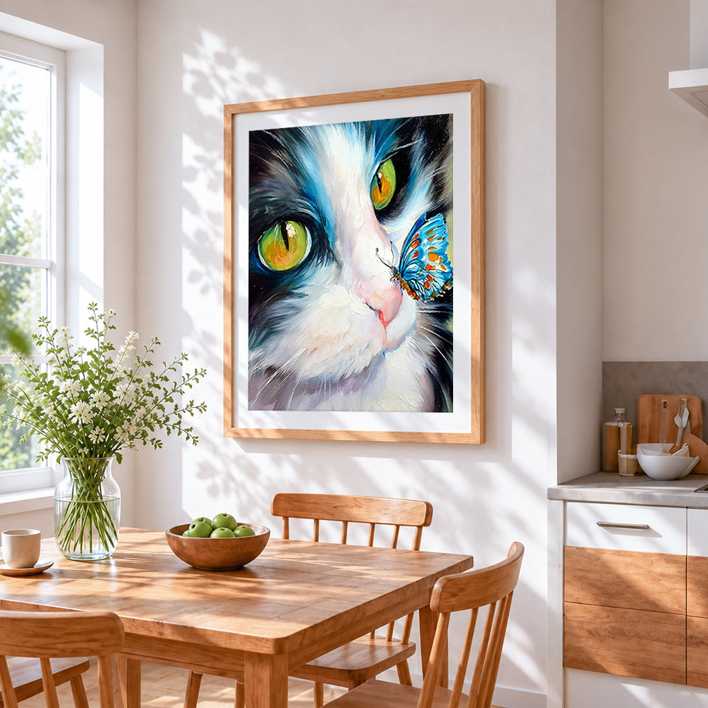 The curious cat and blue butterfly cross stitch artwork displayed on wall as home decor
