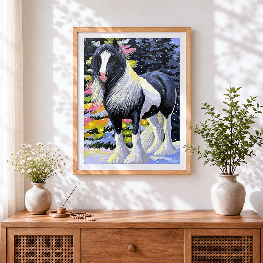 Finished the piebald horse in winter cross stitch artwork displayed