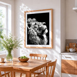 The profile of a lion cross stitch artwork displayed on wall as home decor