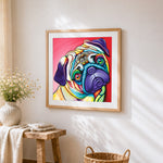 The vibrant pug cross stitch artwork displayed on wall as home decor