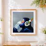 Finished thoughtful chimpanzee with colourful headphones cross stitch artwork displayed