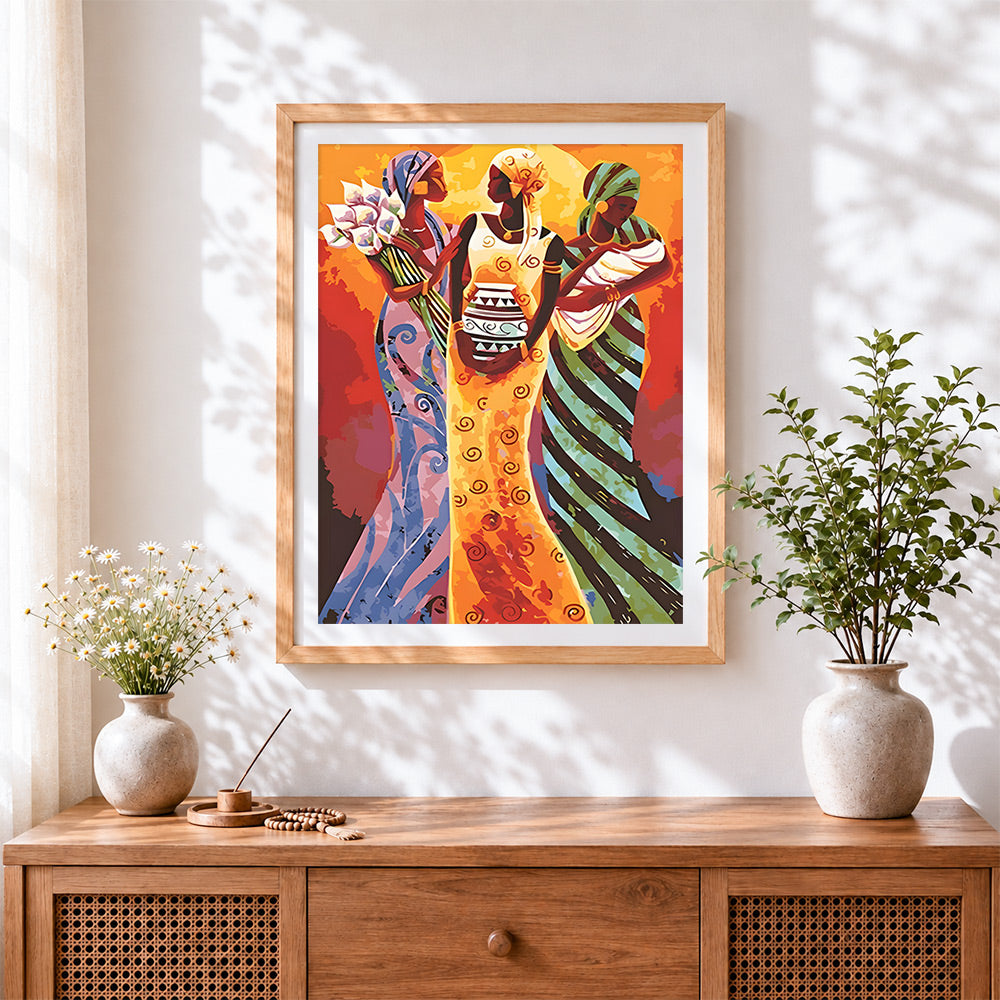 Finished three african women with pot cross stitch artwork displayed