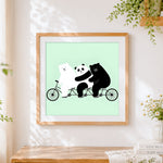 Finished three bears on a bicycle cross stitch artwork displayed