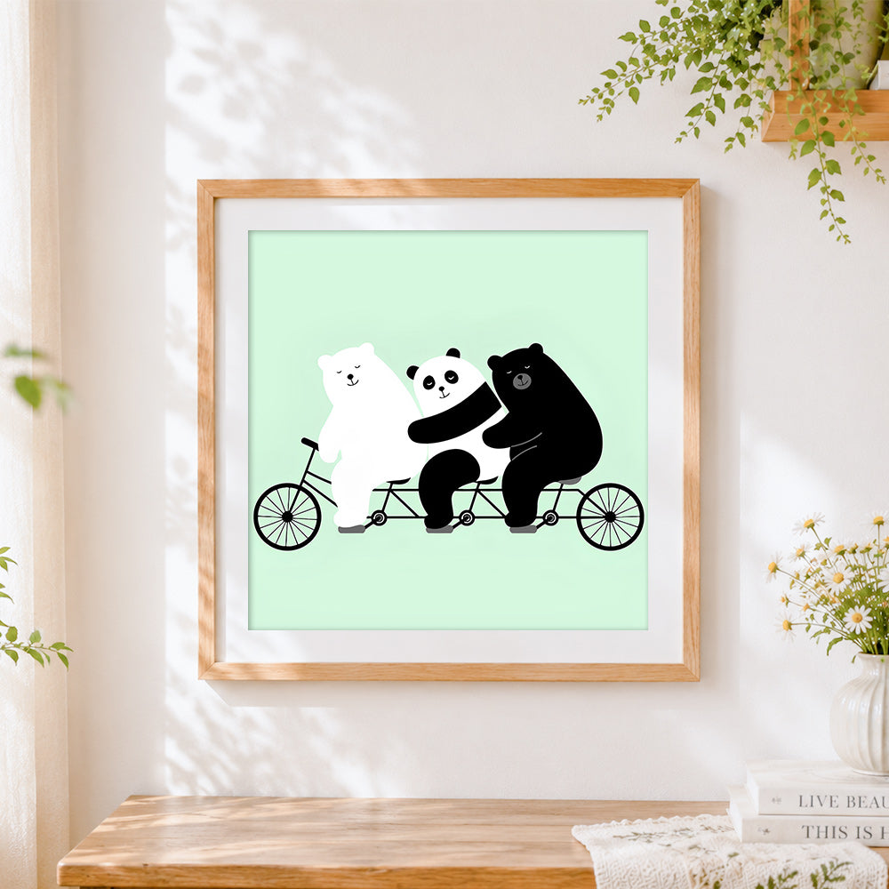 Finished three bears on a bicycle cross stitch artwork displayed