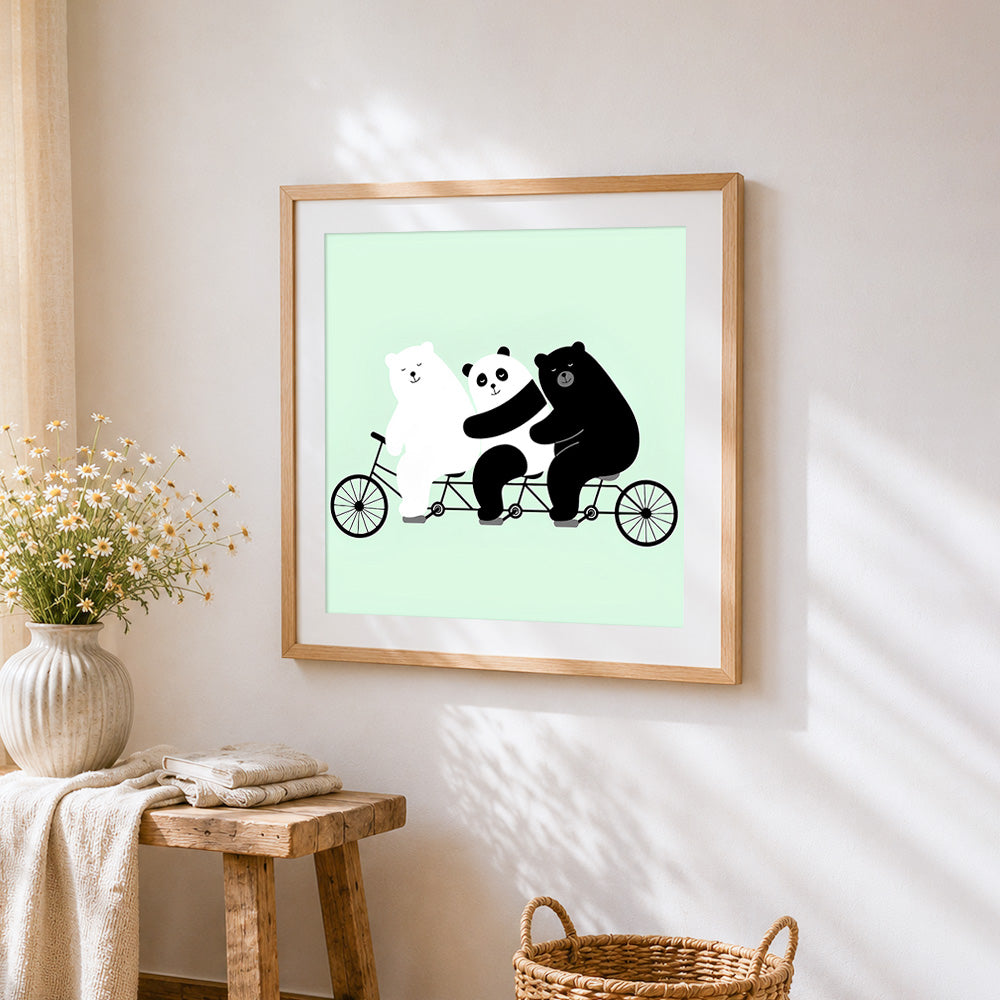 Three bears on a bicycle cross stitch artwork displayed on wall as home decor