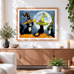 Finished three black cats in witch hats on pumpkins cross stitch artwork displayed