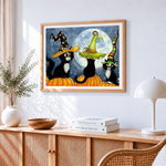 Three black cats in witch hats on pumpkins paint by numbers artwork displayed on wall as home decor