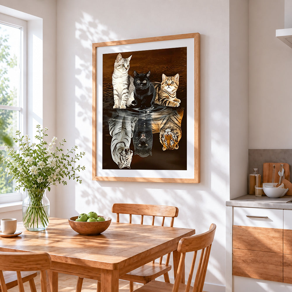 Three cats and tiger reflections cross stitch artwork displayed on wall as home decor