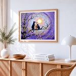 Three cats sitting on a branch cross stitch artwork displayed on wall as home decor