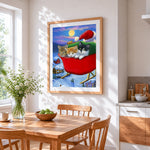 Three cute kittens in a sleigh cross stitch artwork displayed on wall as home decor