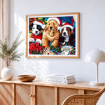 Three festive puppies with christmas treats cross stitch artwork displayed on wall as home decor