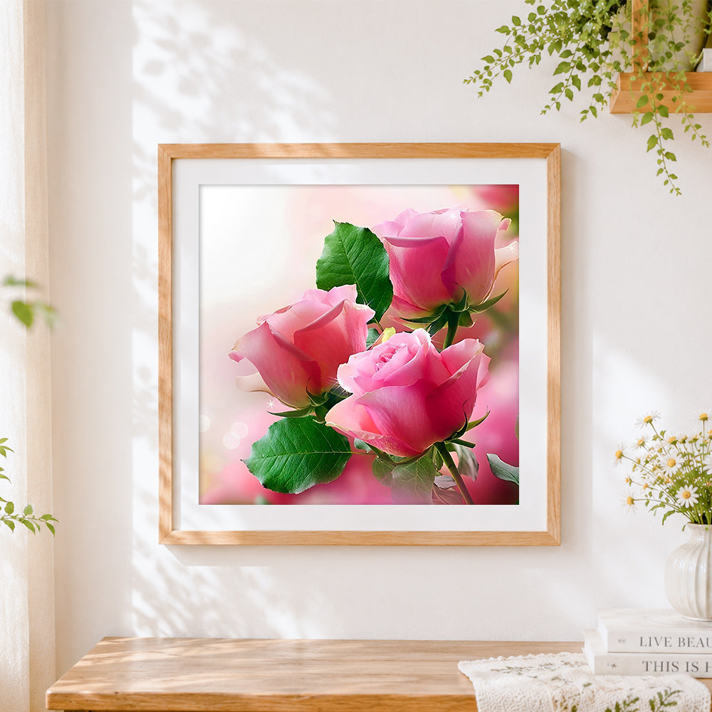 Finished three pink roses cross stitch artwork displayed